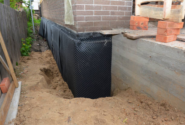 Happy homeowners after waterproofing job in Bryantown
